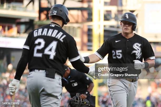 Andrew Vaughn of the Chicago White Sox celebrates his two run fifth inning home run with Yasmani Grandal while playing the Detroit Tigers at Comerica...