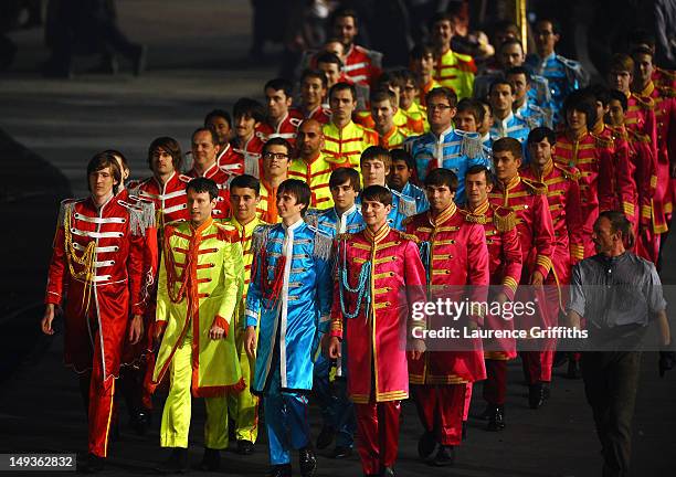 Performers dressed in the suits worn by The Beatles on the cover of their album 'Sgt. Pepper's Lonely Hearts Club Band' during the Opening Ceremony...