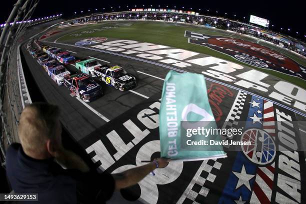 Tanner Gray, driver of the Black's Tire Toyota, and Ty Majeski, driver of the Road Ranger Ford, lead the field to the green flag to start the NASCAR...