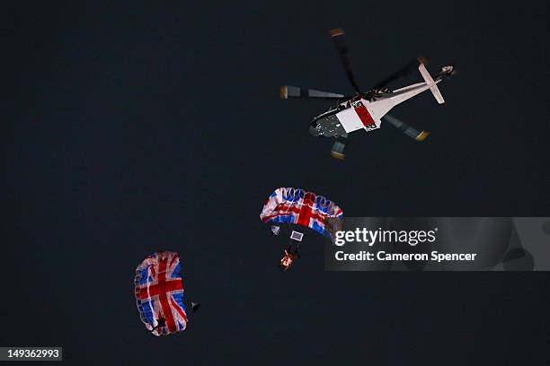 Gary Connery and Mark Sutton parachute into the stadium as part of short James Bond film featuring Daniel Craig and The Queen during the Opening...