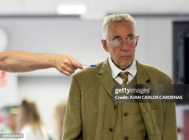 Spanish anaethetist Juan Maeso is shown to his seat in court in Valencia where he is charged with infecting over 276 patients with the Hepatitis C...
