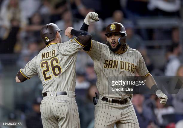 Fernando Tatis Jr. #23 of the San Diego Padres celebrates his two run home run with teammate Austin Nola in the sixth inning against the New York...