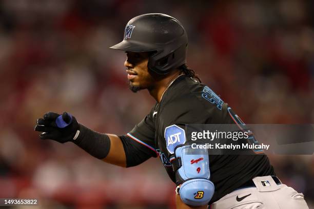 Jean Segura of the Miami Marlins celebrates after bunting to reach first base during the sixth inning against the Los Angeles Angels at Angel Stadium...