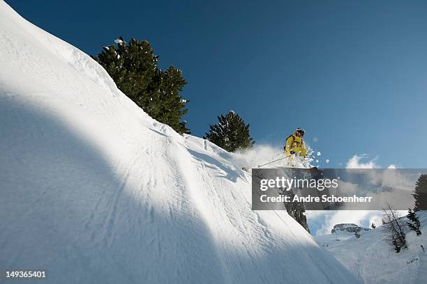 cliff drop - freestyle skiing stock pictures, royalty-free photos & images