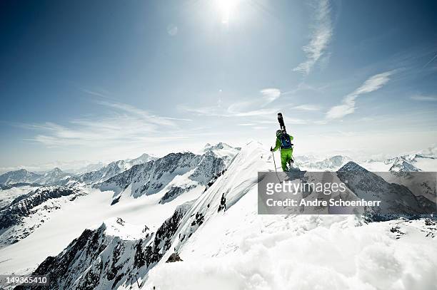skier on a snowy ridge - freestyle skiing foto e immagini stock