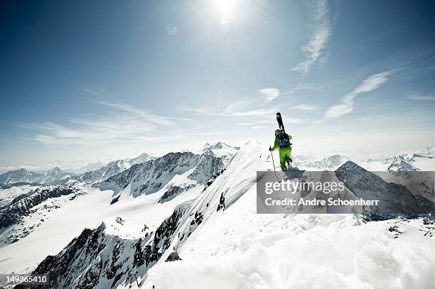 skier on a snowy ridge - mountain snow skiing stock pictures, royalty-free photos & images