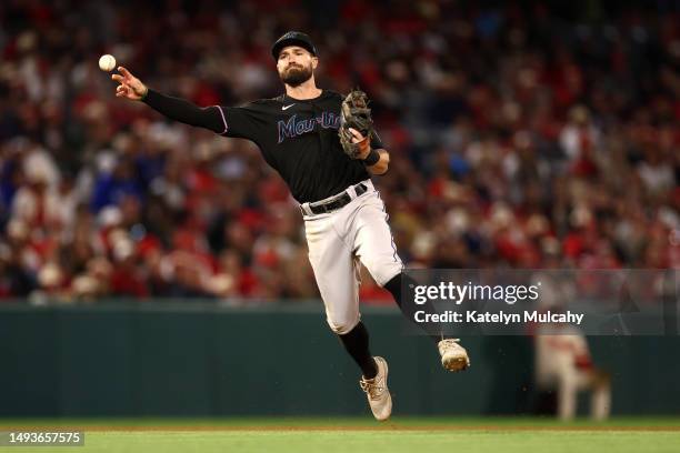 Jon Berti of the Miami Marlins makes the throw to first base during the seventh inning against the Los Angeles Angels at Angel Stadium of Anaheim on...
