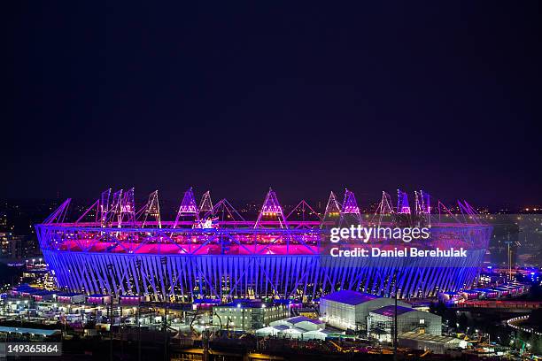 The Olympic Stadium is illuminated during the opening ceremony of the 2012 London Olympic Games on July 27, 2012 in London, England. Athletes, heads...