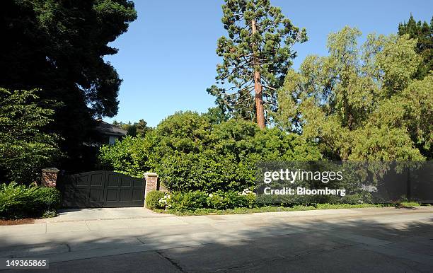 Trees covers the front of Facebook Inc.'s Chief Executive Officer Mark Zuckerberg's house in Palo Alto, California, U.S. On Saturday, July 14, 2012....