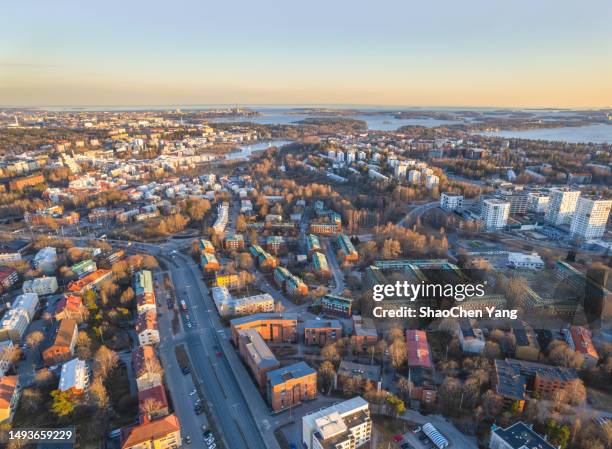 aerial view of city road and buildings in helsinki while sunset - helsinki city foto e immagini stock