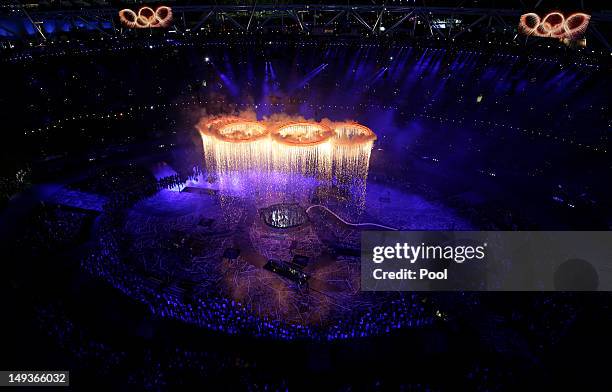 Rings representing both the Olympics and the Industrial Revolution are lit and lifted during the Opening Ceremony of the London 2012 Olympic Games at...