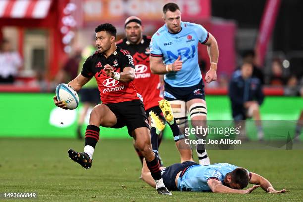 Richie Mo'unga of the Crusaders charges forward during the round 14 Super Rugby Pacific match between Crusaders and NSW Waratahs at Orangetheory...