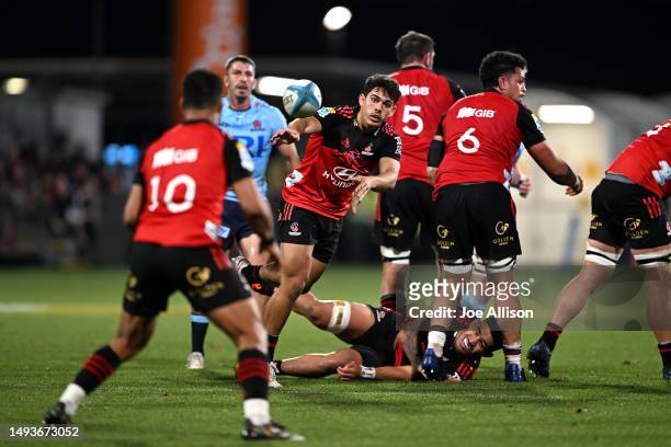 Noah Hotham of the Crusaders passes the ball during the round 14 Super Rugby Pacific match between Crusaders and NSW Waratahs at Orangetheory...