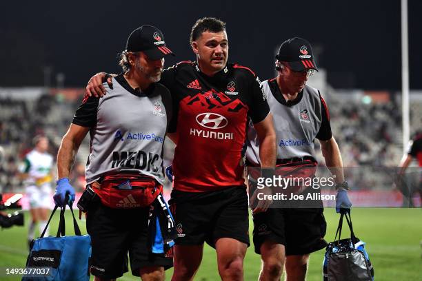 David Havili of the Crusaders is assisted from the field during the round 14 Super Rugby Pacific match between Crusaders and NSW Waratahs at...