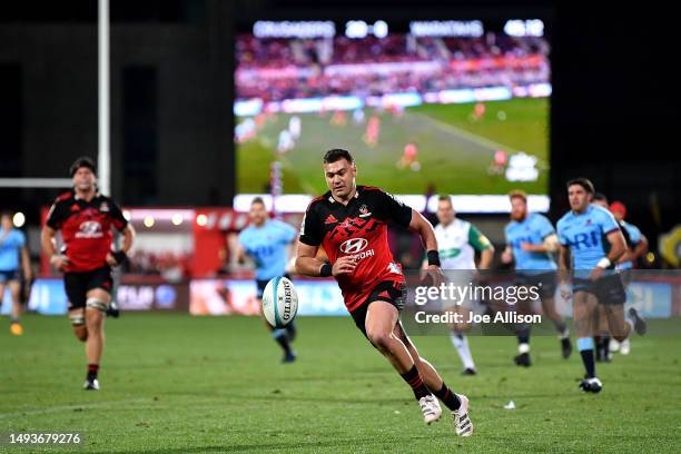 David Havili of the Crusaders looks to secure the ball during the round 14 Super Rugby Pacific match between Crusaders and NSW Waratahs at...