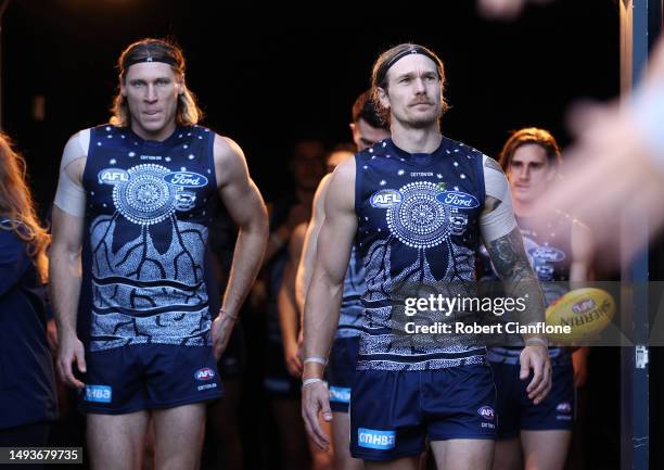 The Cats head out during the round 11 AFL match between Geelong Cats and Greater Western Sydney Giants at GMHBA Stadium, on May 27 in Geelong,...