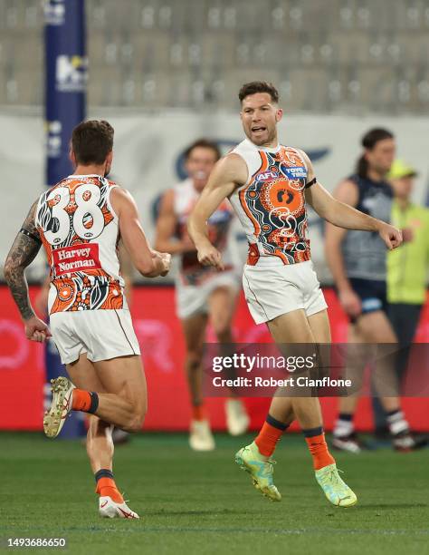 Toby Greene of the Giants celebrates after scoring a goal during the round 11 AFL match between Geelong Cats and Greater Western Sydney Giants at...