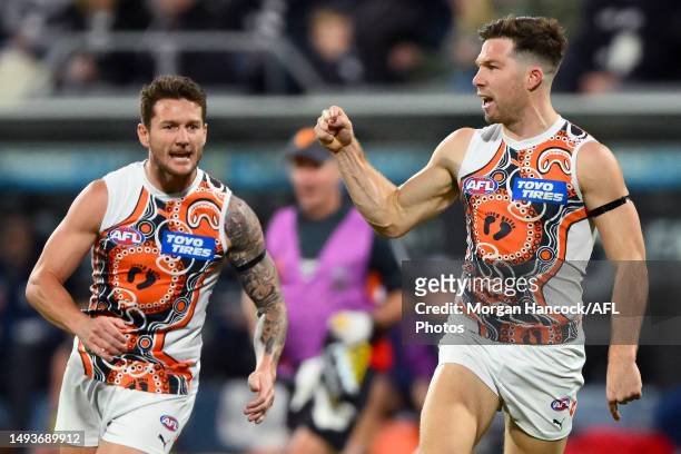 Toby Greene of the Giants celebrates a goal during the round 11 AFL match between Geelong Cats and Greater Western Sydney Giants at GMHBA Stadium, on...