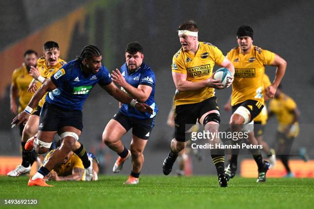 James Blackwell of the Hurricanes makes a break during the round 14 Super Rugby Pacific match between Blues and Hurricanes at Eden Park, on May 27 in...