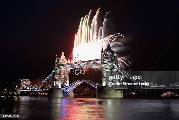 Fireworks explode from Tower Bridge during the opening ceremony of the London 2012 Olympic Games on July 27, 2012 in London, England.