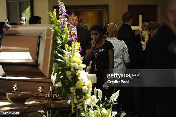 Mourners attend the funeral of Alexander Jonathan 'A.J.' Boik at Queen of Peace Catholic church on July 27, 2012 in Aurora, Colorado. Boik was one of...