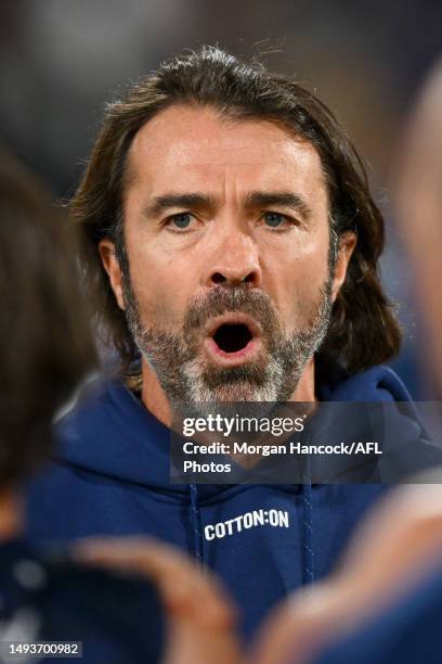 Cats head coach, Chris Scott speaks to players at the huddle during the round 11 AFL match between Geelong Cats and Greater Western Sydney Giants at...