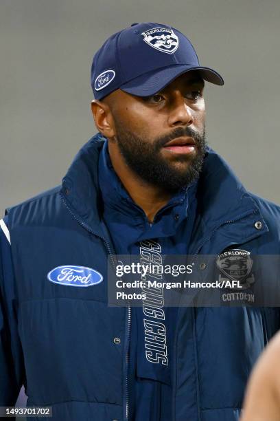 Esava Ratugolea of the Cats stands at the huddle after being subbed off during the round 11 AFL match between Geelong Cats and Greater Western Sydney...