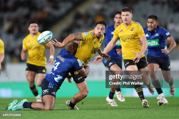 Billy Proctor of the Hurricanes offloads the ball during the round 14 Super Rugby Pacific match between Blues and Hurricanes at Eden Park, on May 27...