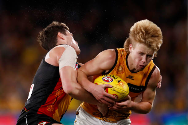 Jack Steele of the Saints tackles Cam Mackenzie of the Hawks during the round 11 AFL match between St Kilda Saints and Hawthorn Hawks at Marvel...