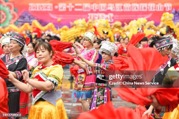 Miao people in traditional costumes dance during the 12th China Wujiang Miao Caihuashan Festival, also known as the Valentine's Day of the Miao...