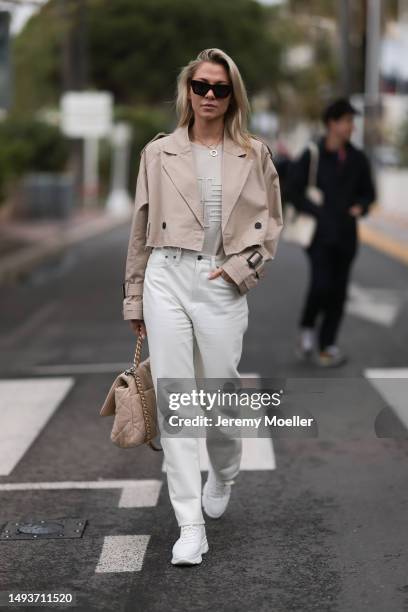 Valentina Pahde seen wearing Chanel beige bag, Cartier love yellowgold necklace, white jeans shorts, Riani beige sweater, cropped beige trench...