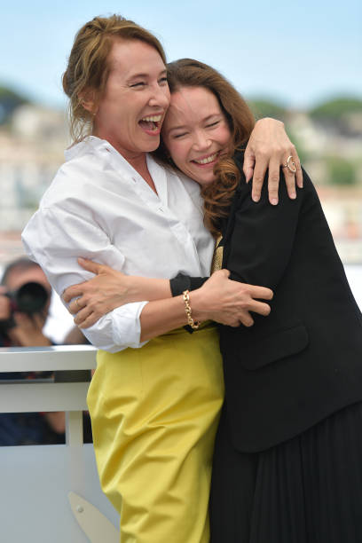 FRA: "L'Abbé Pierre" Photocall - The 76th Annual Cannes Film Festival