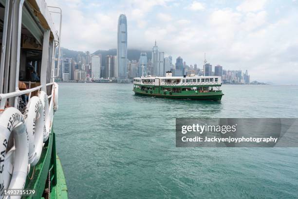 star ferry in the mist hong kong harbour - tsim sha tsui stock pictures, royalty-free photos & images