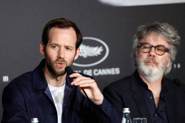 FRA: "L'Abbé Pierre" Press Conference - The 76th Annual Cannes Film Festival