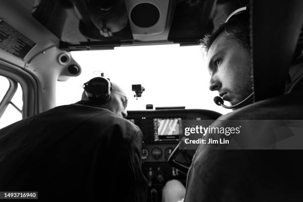 panoramic views unfold on both sides within the aircraft cabin - 2 sides stock pictures, royalty-free photos & images