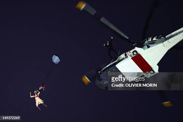 An actor dressed to resemble Britain's Queen Elizabeth II parachutes into the stadium during the opening ceremony of the London 2012 Olympic Games at...