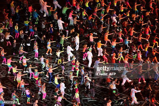 Dancers perform during the opening ceremony of the London 2012 Olympic Games at the Olympic Stadium on July 27, 2012 in London. AFP PHOTO / EZRA SHAW