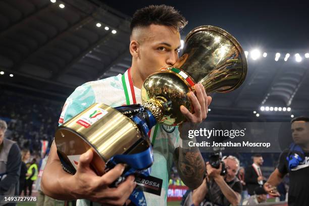 Lautaro Martinez of FC Internazionale kisses the trophy following the 2-1 victory in the Coppa Italia Final match between ACF Fiorentina and FC...