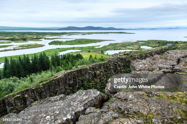 joining of two tectonic plates. (eurasian tectonic plate and the north american tectonic plate.) almannagja. iceland. - thingvellir stock pictures, royalty-free photos & images
