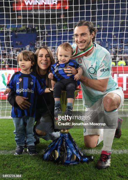 Matteo Darmian of FC Internazionale with his wife Francesca Cormanni and children Achille and Gregorio pose with the trophy following the 2-1 victory...