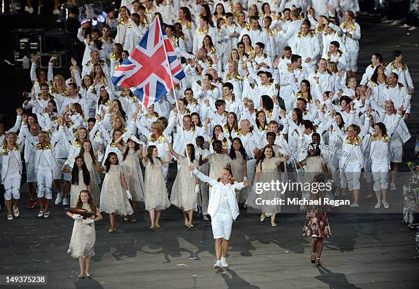 Sir Chris Hoy of the Great Britain Olympic cycling team carries his country's flag during the Opening Ceremony of the London 2012 Olympic Games at...