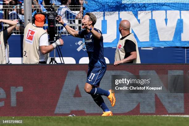 Takuma Asano of Bochum celebrates the second goal with his team matey during the Bundesliga match between VfL Bochum 1848 and Bayer 04 Leverkusen at...