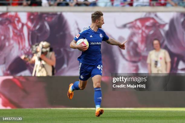 Sebastian Polter of FC Schalke 04 celebrates after Willi Orban of RB Leipzig scores an own goal to make it their second goal of FC Schalke 04 during...