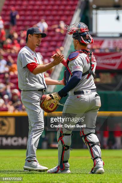 Giovanny Gallegos and Andrew Knizner of the St. Louis Cardinals celebrate after beating the Cincinnati Reds 2-1 at Great American Ball Park on May...