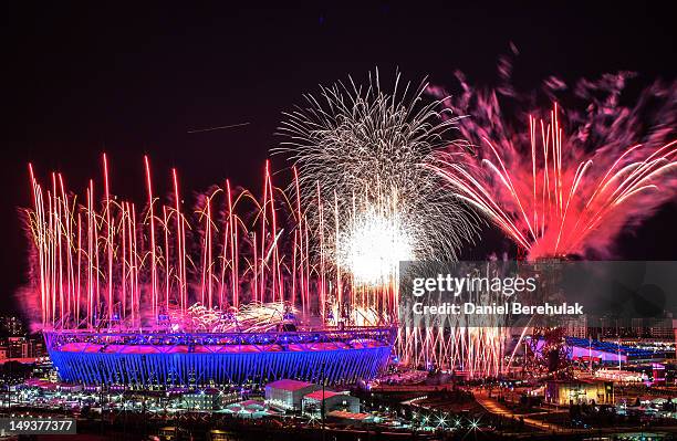 Fireworks explode over the Olympic Stadium during the opening ceremony of the 2012 London Olympic Games on July 27, 2012 in London, England....