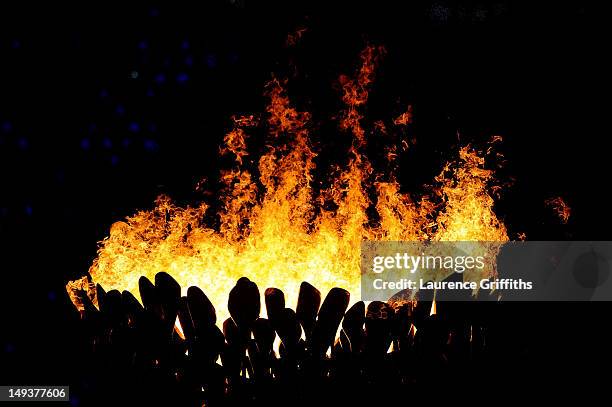 The Olympic flame burns in the cauldron during the Opening Ceremony of the London 2012 Olympic Games at the Olympic Stadium on July 27, 2012 in...