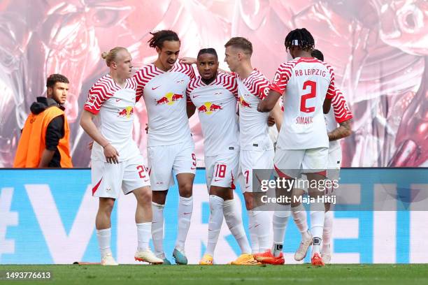 Yussuf Poulsen of RB Leipzig celebrates with teammates after scoring the team's third goal during the Bundesliga match between RB Leipzig and FC...