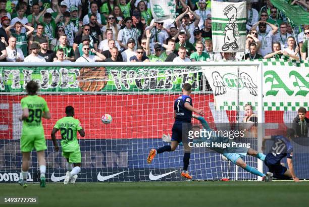 Ibrahim Maza of Hertha Berlin scores the team's first goal past Koen Casteels of VfL Wolfsburg during the Bundesliga match between VfL Wolfsburg and...