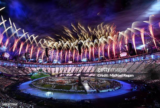 Fireworks burst above the stadium during the Opening Ceremony of the London 2012 Olympic Games at the Olympic Stadium on July 27, 2012 in London,...