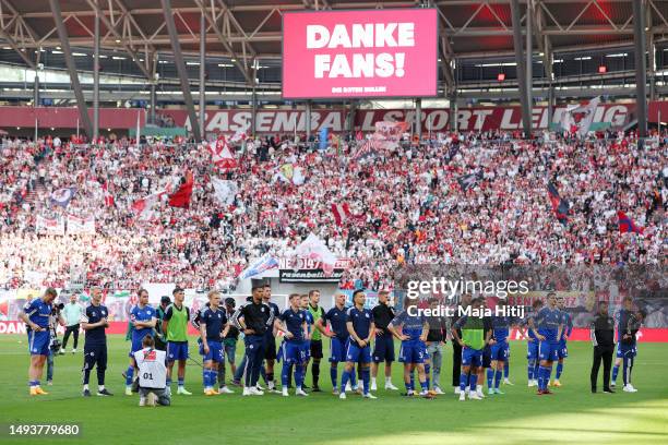 Players of FC Schalke 04, acknowledge the fans after the team's defeat leading to their relegation after the Bundesliga match between RB Leipzig and...